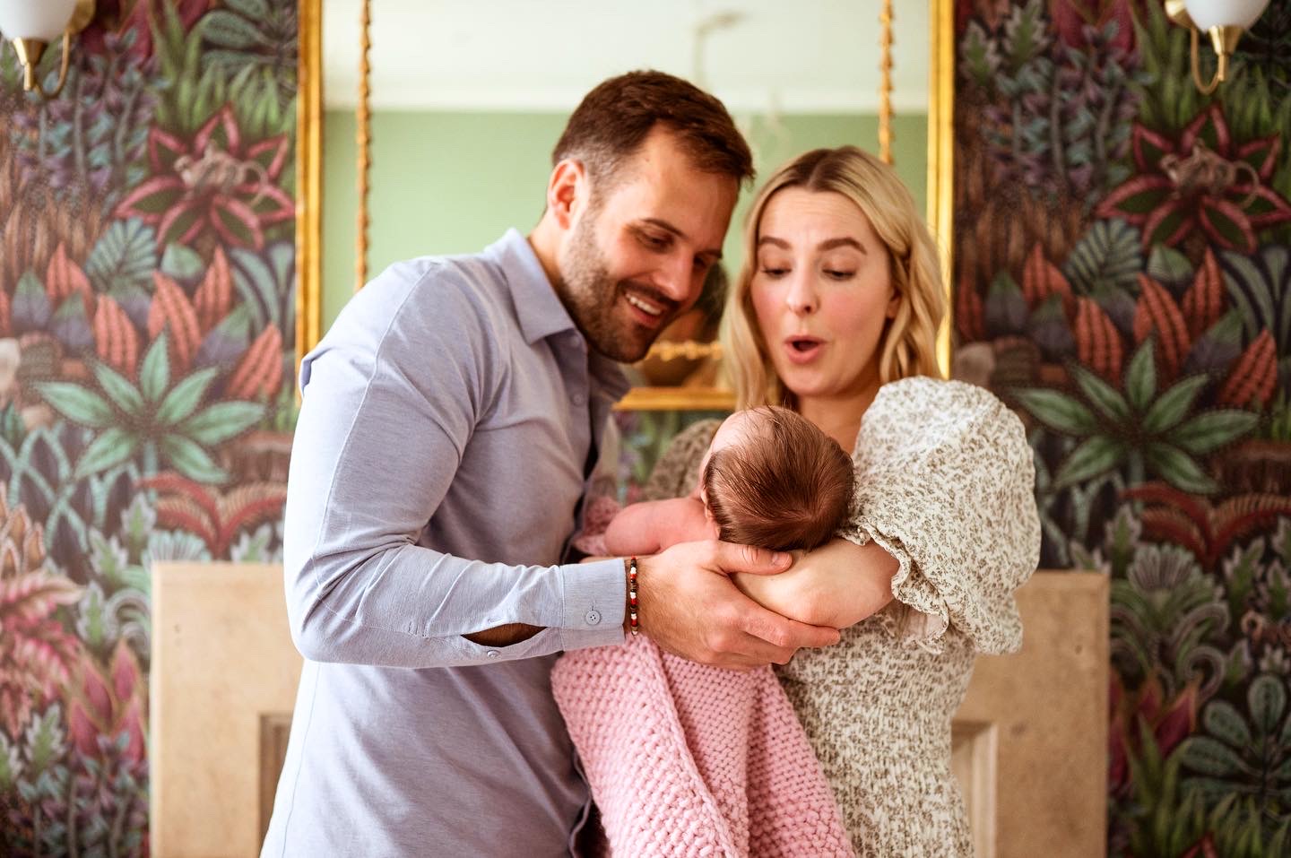 parents cooing over baby by London baby photographer Andrea Whelan